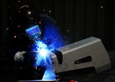 A Bromarc Employee welding a 3mm steel box.