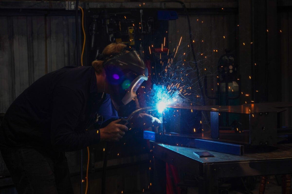 An Experienced Welder TIG welding a steel box in Bromarc's Australian Manufacturing workshop